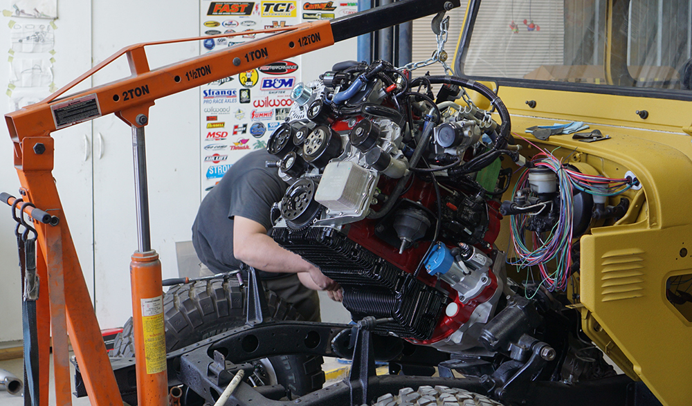 r28-engine-being-lowered-into-repowered-clean-cruiser-project.jpg