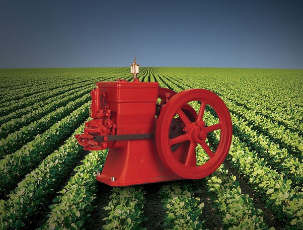 classic cummins engine shown over a crop field