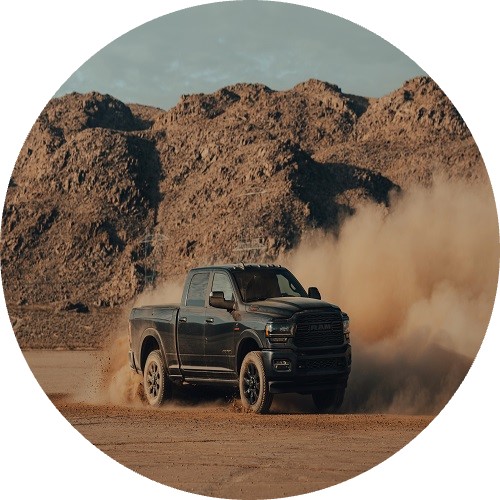 pickup truck driving in dirt