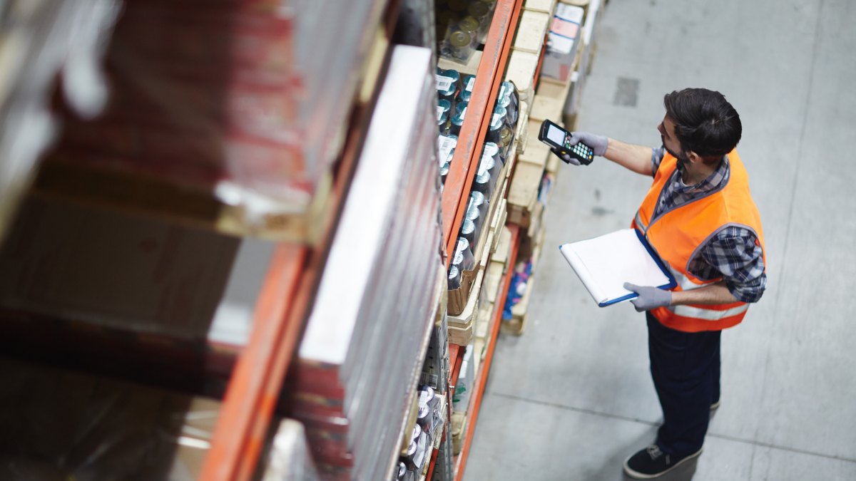 warehouse worker scanning product