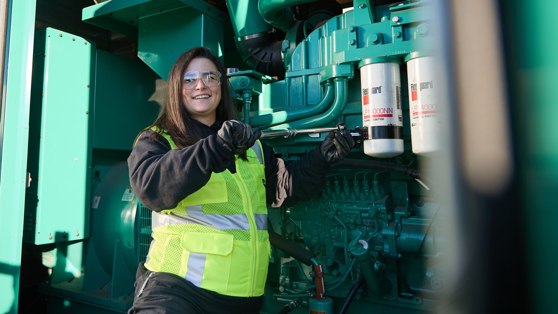 Technician working on a Cummins generator
