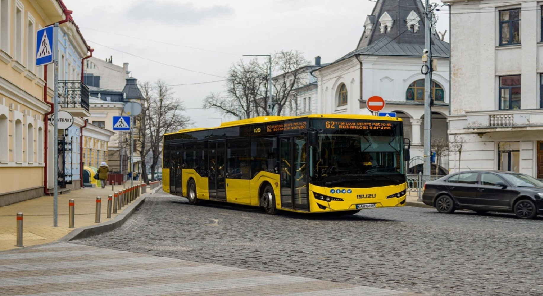 Yellow bus driving on road