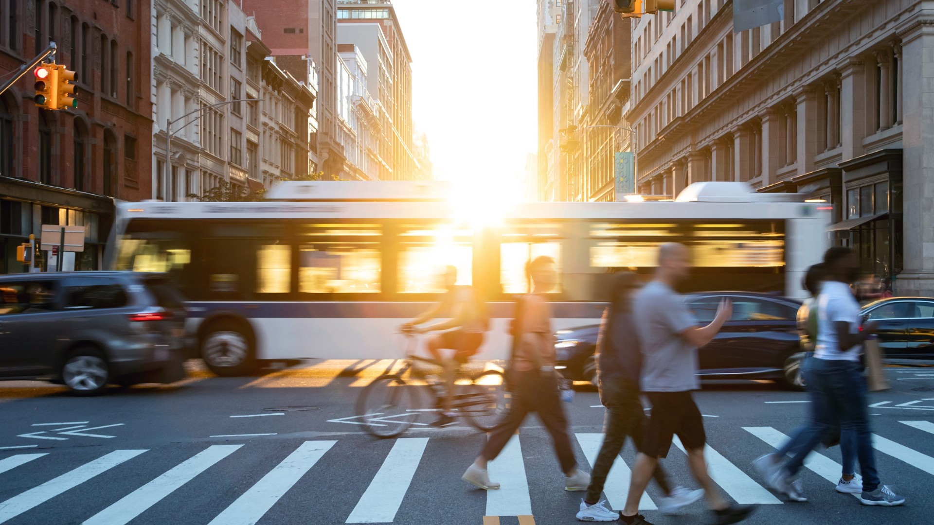 intersection with city bus and pedestrians