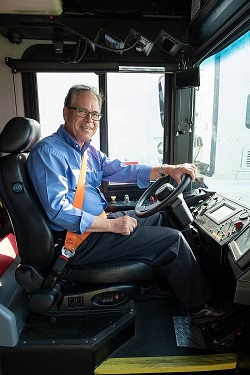 U.S. Sen. Mike Braun behind the wheel of an electric bus powered by Cummins.