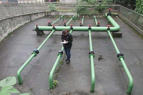 A Cummins employee checks on water use at the company's plant in Chongqing, China.