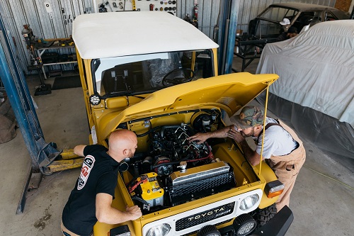 The Clean Cruiser team works on one of its vehicles before the big trip.