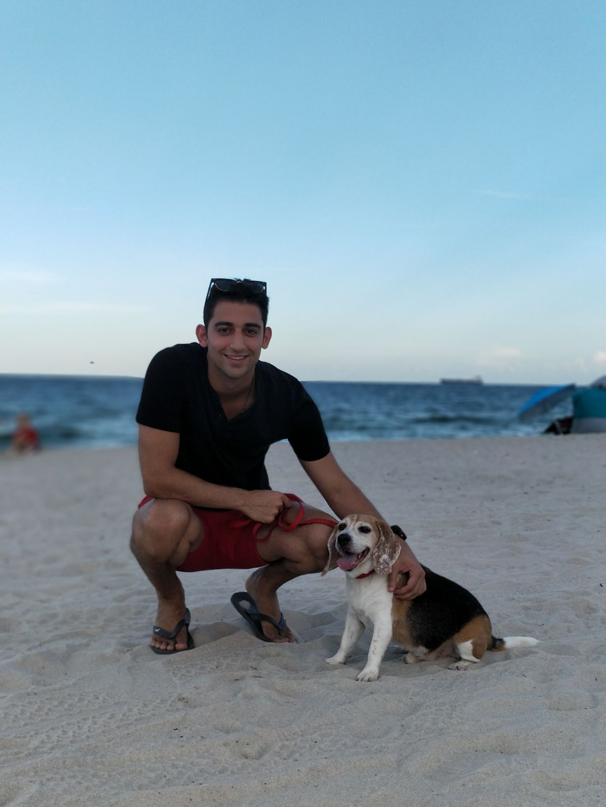 Arvin at the beach with his dog