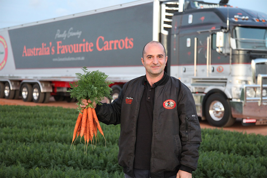 Employee in front of truck