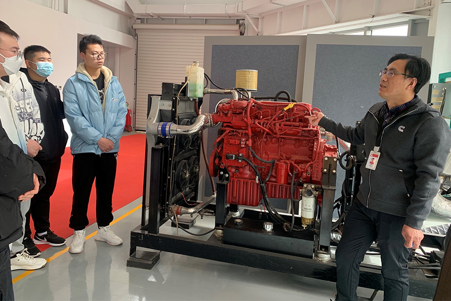 Students instructed on Cummins engine module trainer at MRC (Master Rebuild Center)