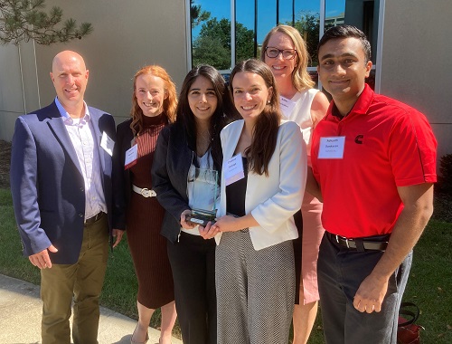 Cummins employees gather after receiving the 2022 Indiana Governor's Award for Environmental Excellence in Indianapolis.