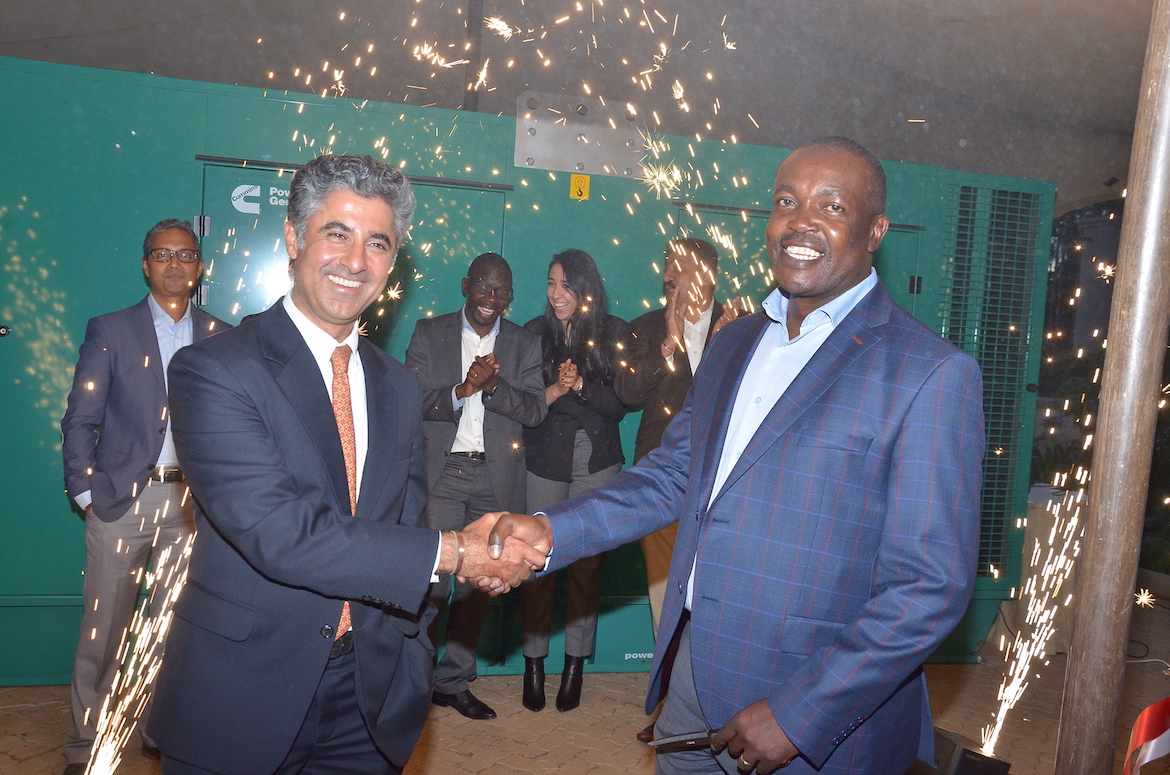 Car & General Group CEO Vijay Gidoomal (left) celebrates the launch with Colonel Olwende of Kenya Defence Forces 