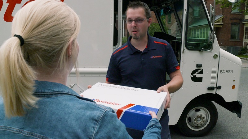 Purolator driver Alexis Picard deliverse a package