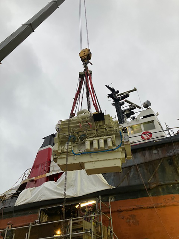 KTA38 marine engine being lowered onto the Seaspan Cavalier