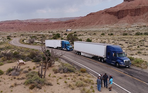 The Cummins team takes a break during 2017 validation testing near Interstate 70 in Central Utah.