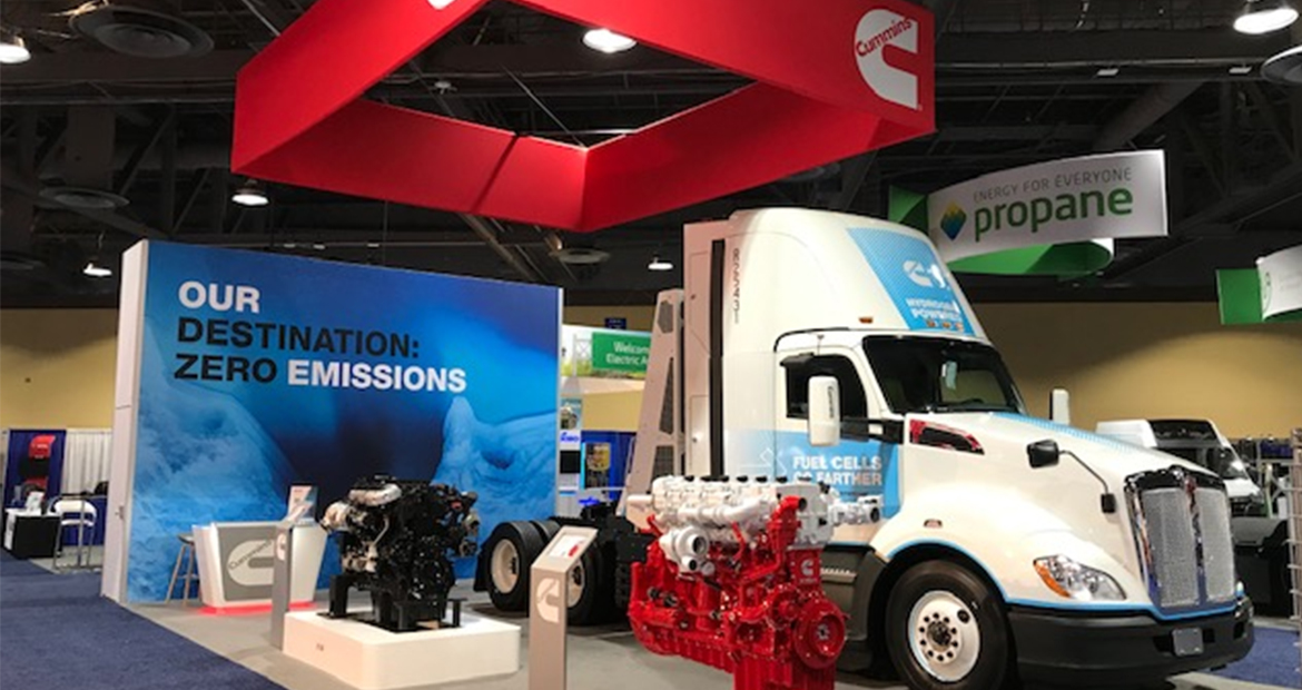 ACT Expo Booth on display with engines and truck