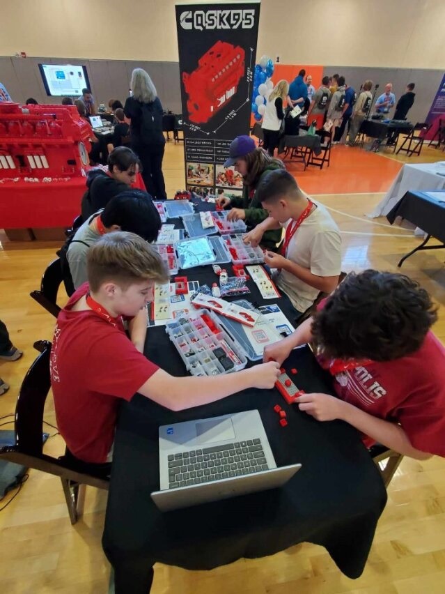 Students building Lego models. 