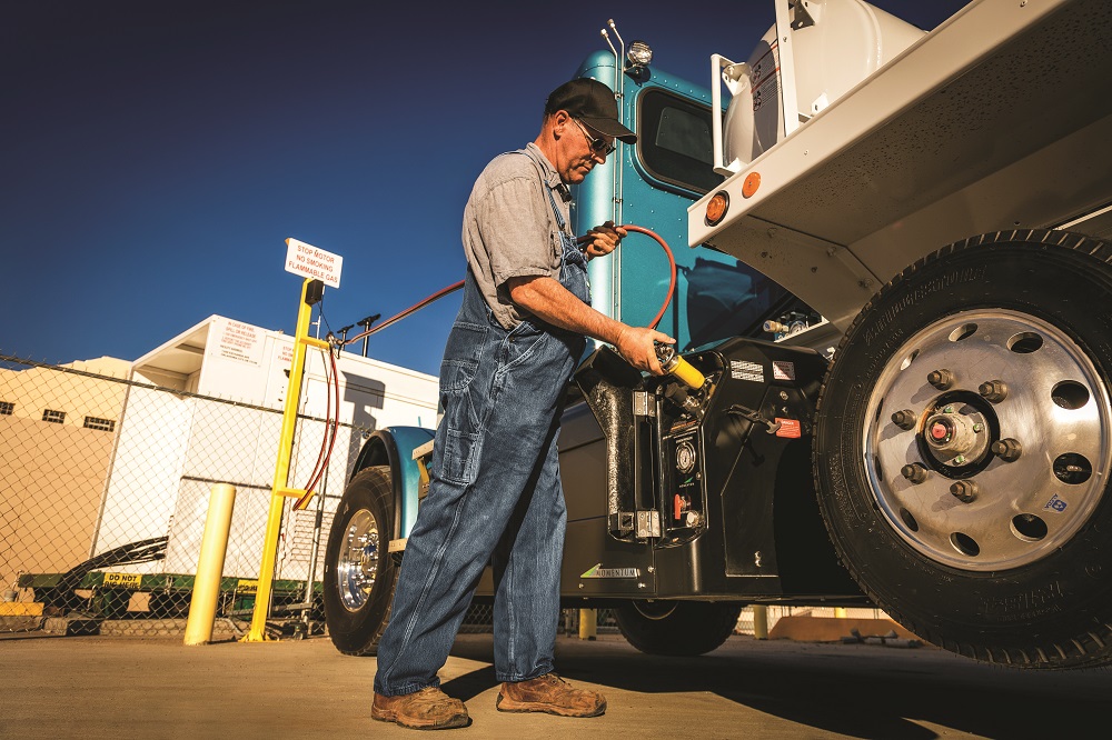 A driver performs a fast-fill refuel of a natural gas powered truck
