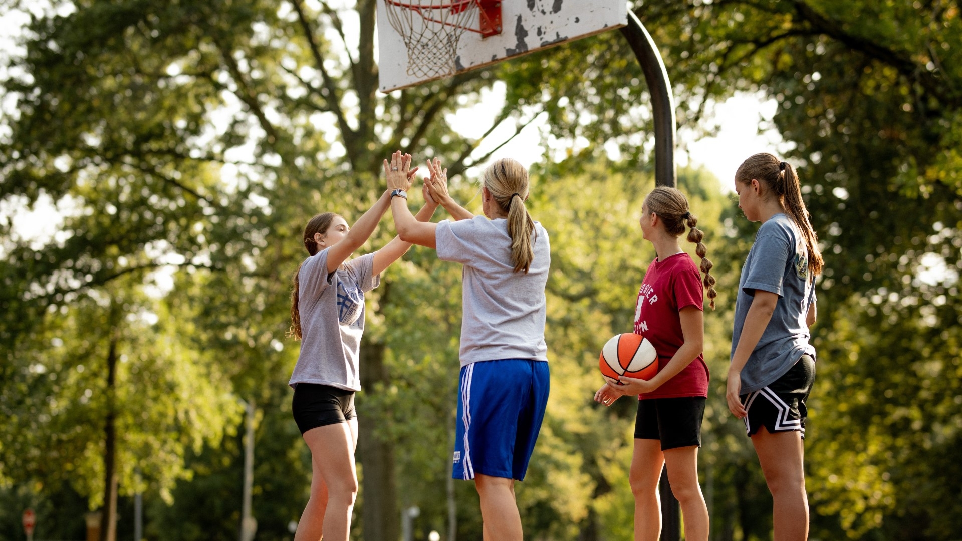 coach and players on basketball court