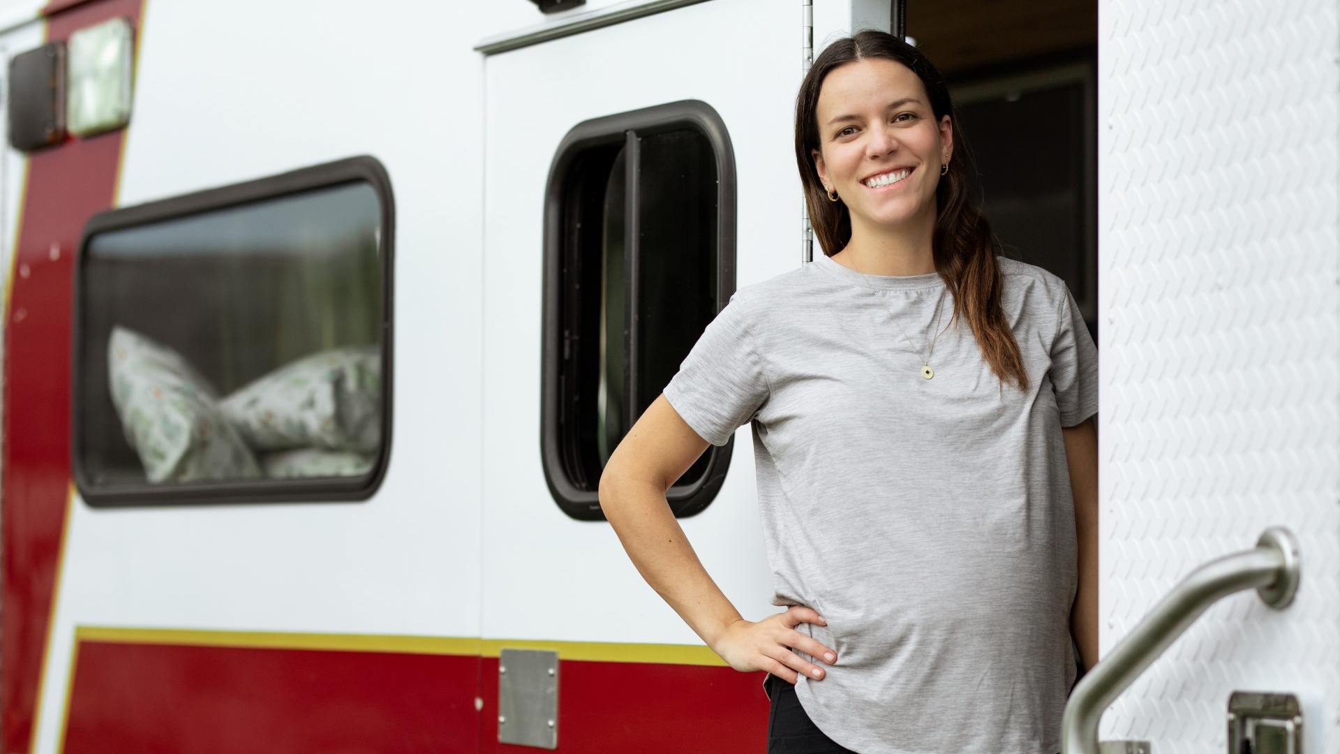 clarissa standing in camper van