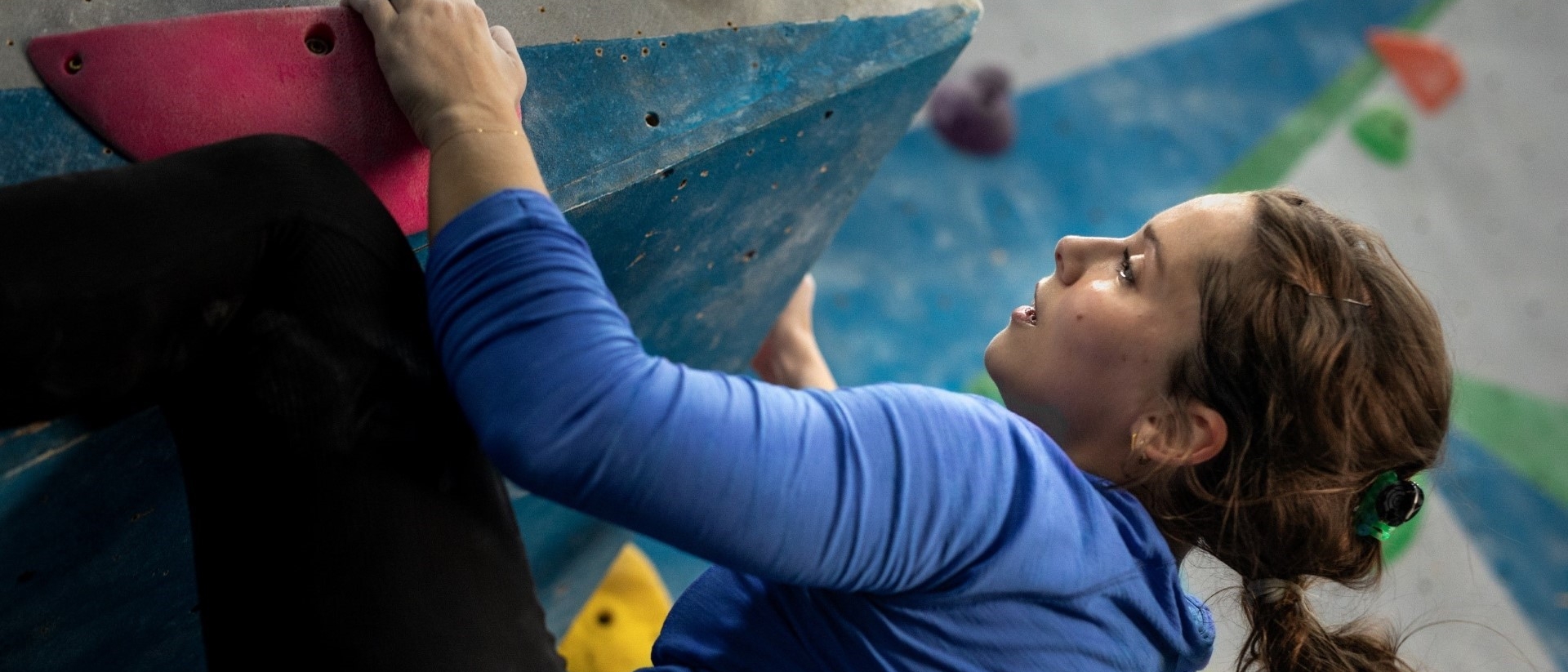 woman on rock climbing wall