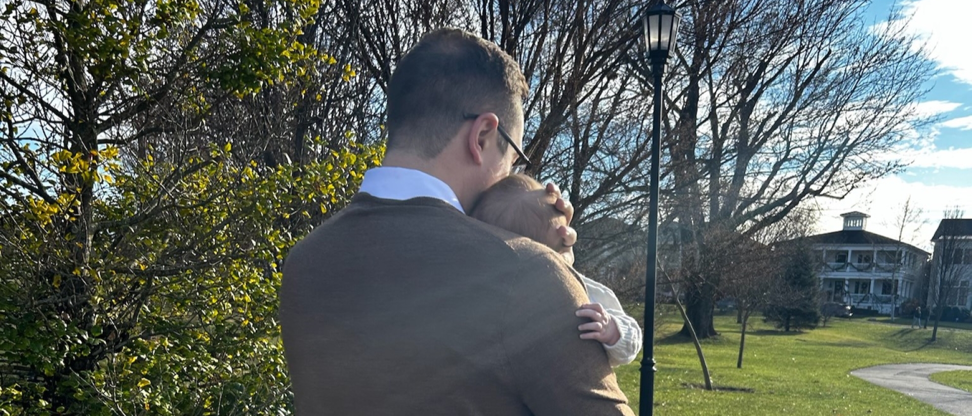 father holding child