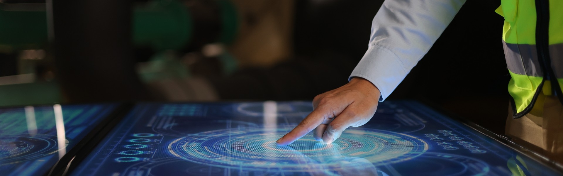 Constructions worker using a massive touch screen on a tablet