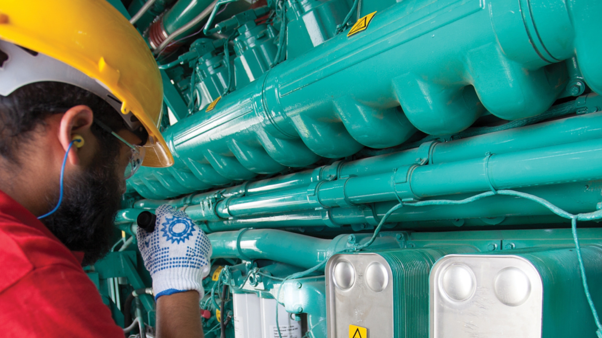 performing maintenance inspection on generator engine