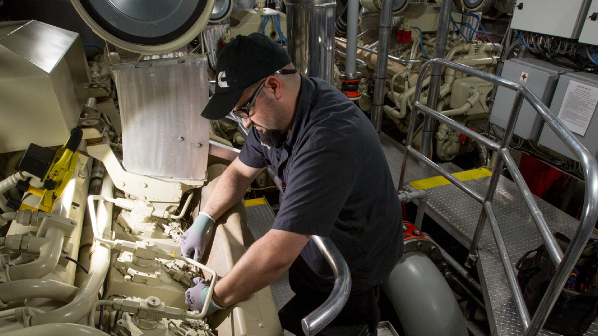 marine technician working on engine