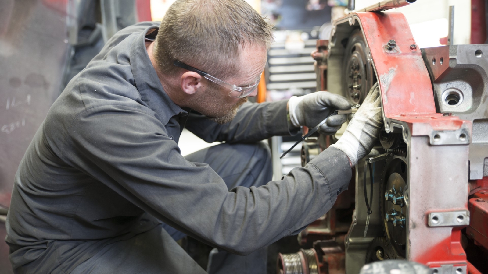 service technician working on engine