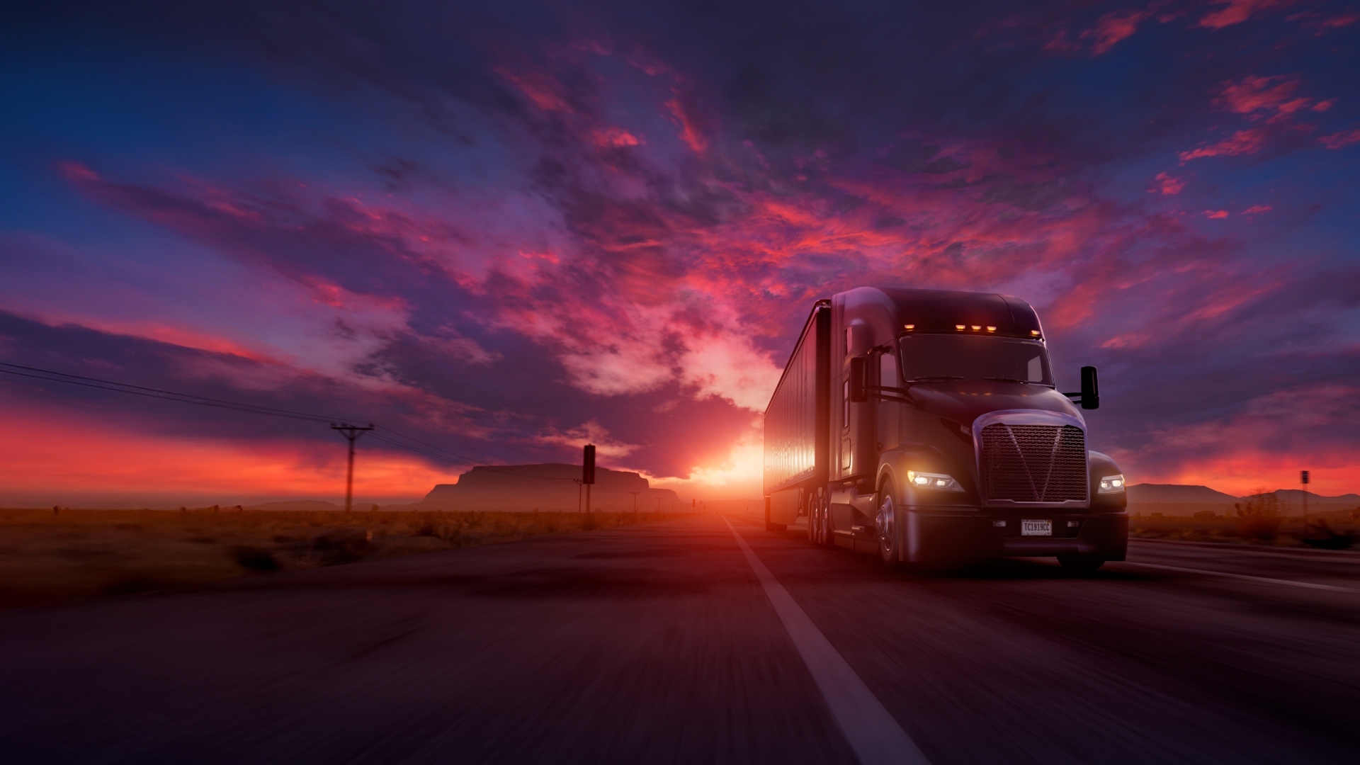 Truck driving with sunset behind it