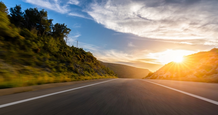 Sunrise behind a highway