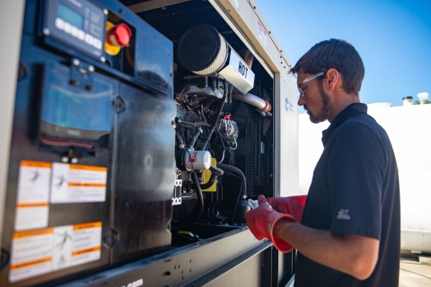 technician servicing generator