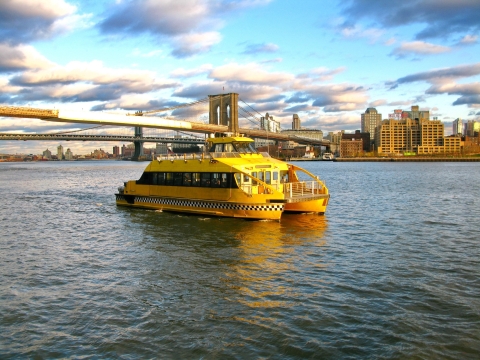 passenger boat ferrying down river