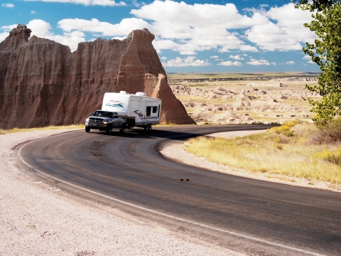 Truck driving up a mountain in the desert