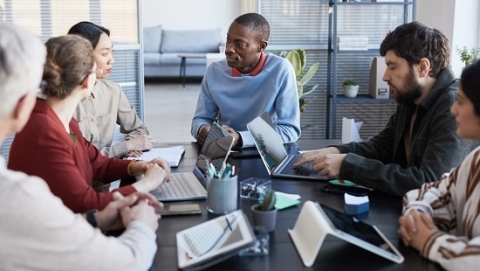 People having a meeting inside an office space