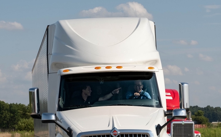 U.S. Sen. Mike Braun takes the wheel of a tractor-trailer powered by a Cummins X15 engine.