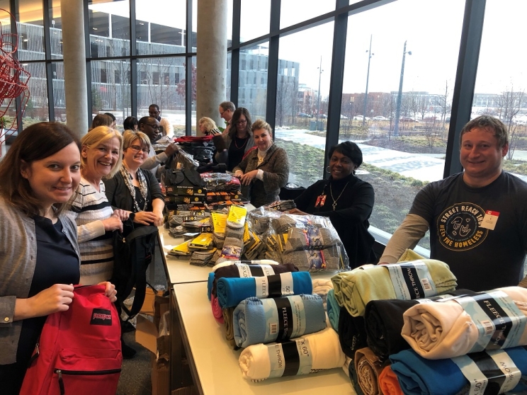 Volunteers assemble winter kits for the homeless in the lobby of Cummins’ Distribution Business Headquarters on the east side of Indianapolis.