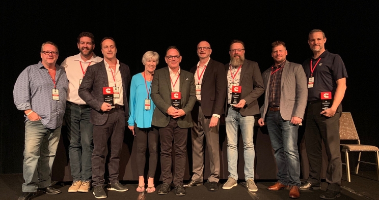 Canada winners holding awards