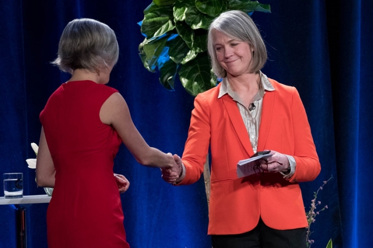 Cummins' Mary Chandler (right) greets Denise Raquel Dunning, founder of Rise Up, at Thursday's announcement.