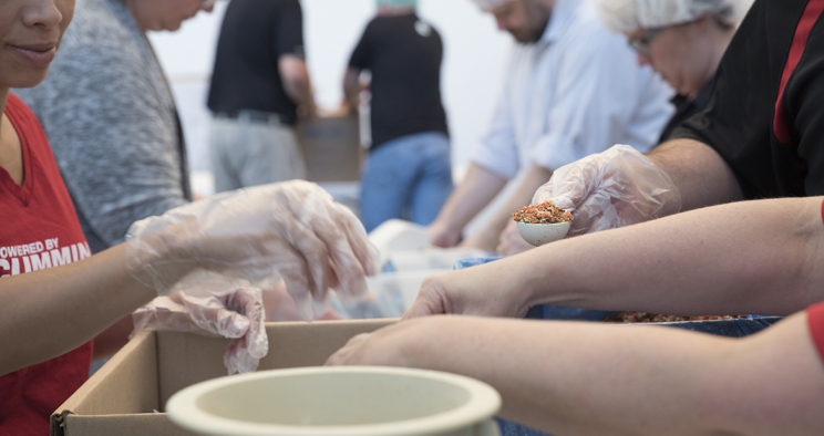 People making clay bowls