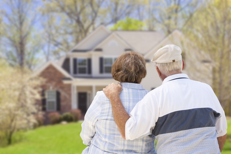 couple looking at their home