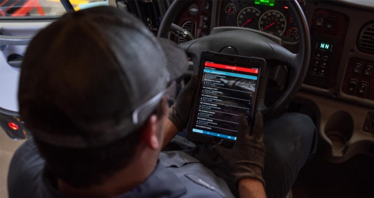 Driver looking at diagnostics app