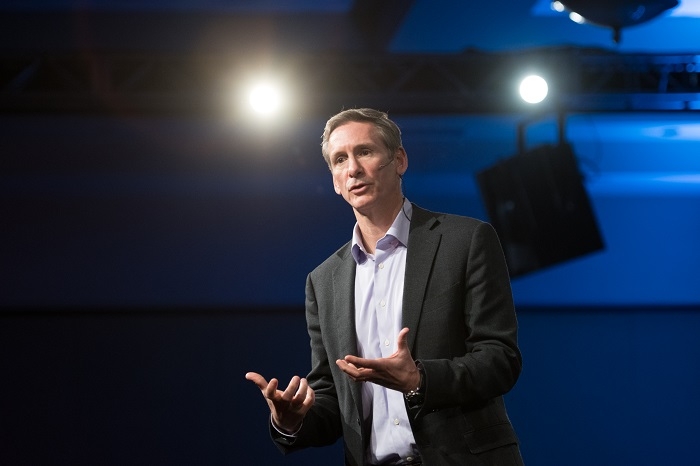 CEO Tom Linebarger speaks at a past event, before the COVID-19 crisis. The 2020 Annual Meeting was held virtually to protect against the spread of the virus.