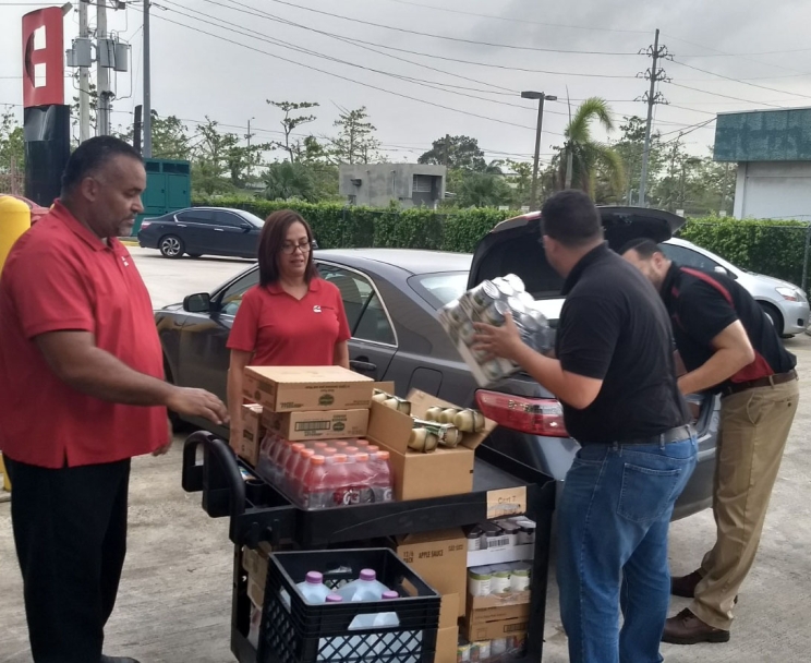 Cummins employees in Puerto Rico unload supplies to keep the branch going over long hours.