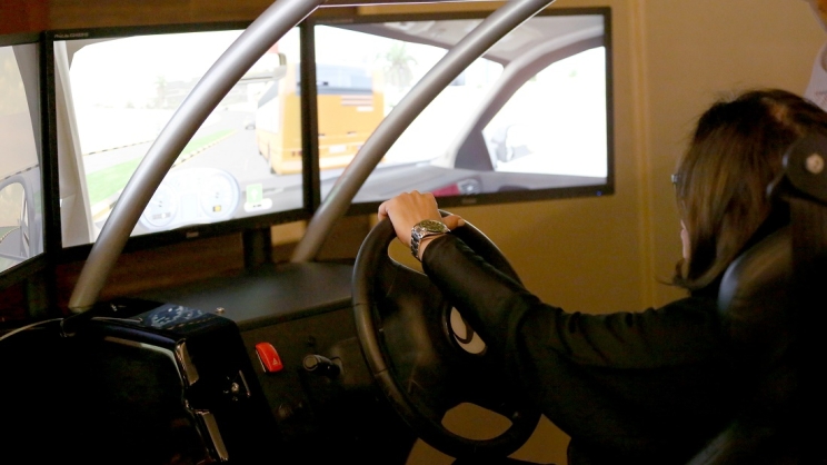 A participant in one of the workshops sponsored by the Cummins and its joint venture partner Olayan learns about driving by using a simulator provided by the program.