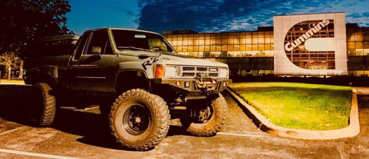 Repowered TAV Toyota Xtra Cab in front of Cummins building