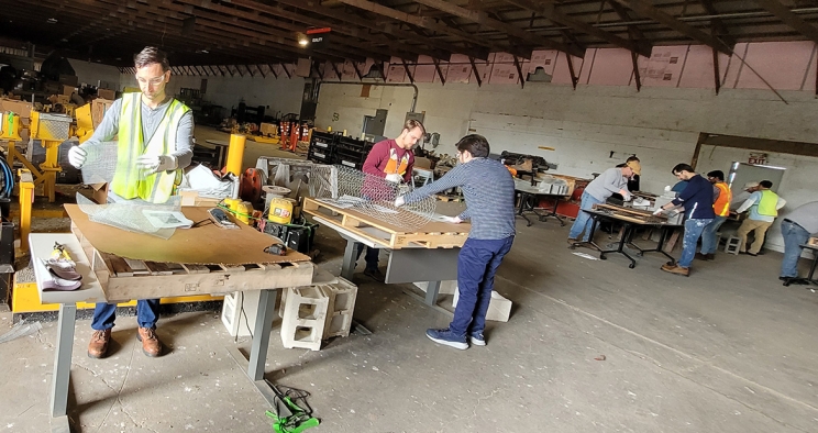 Cummins employees working on initial construction of nesting boxes