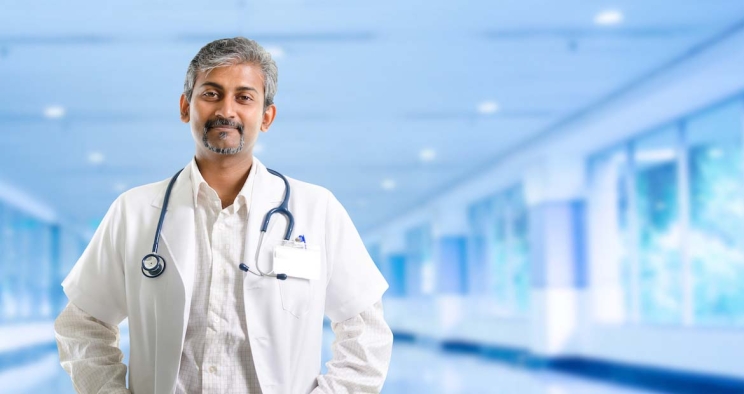 Male doctor standing in health facility 