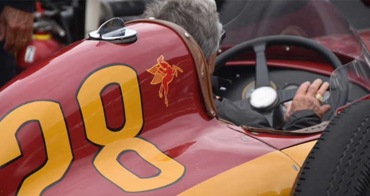 Mario Andretti driving the historic Cummins race car