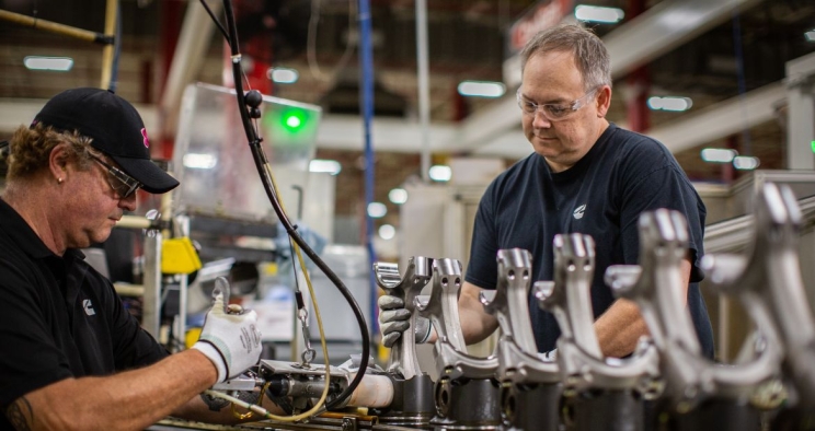 Employees working on engine